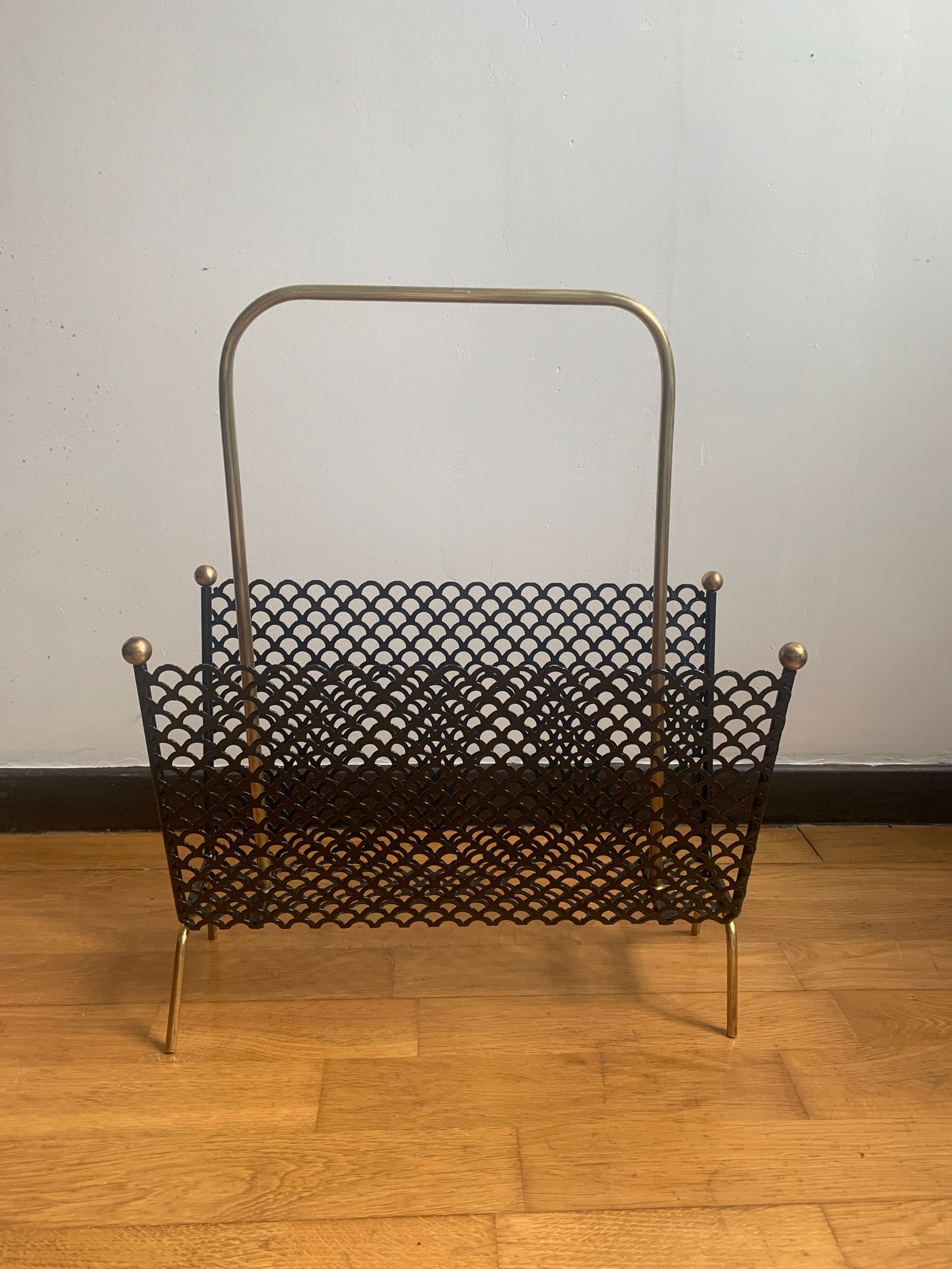 Perforated metal magazine door