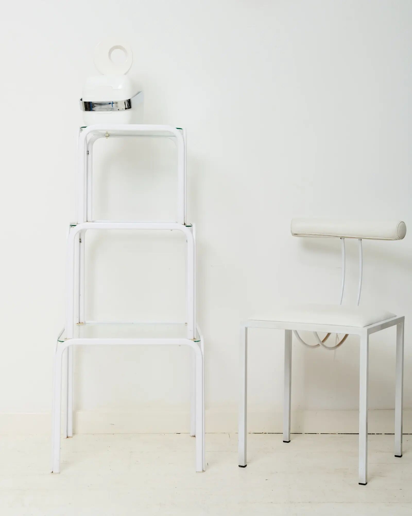 Nested tables in white lacquered metal, Italy, 1970s.