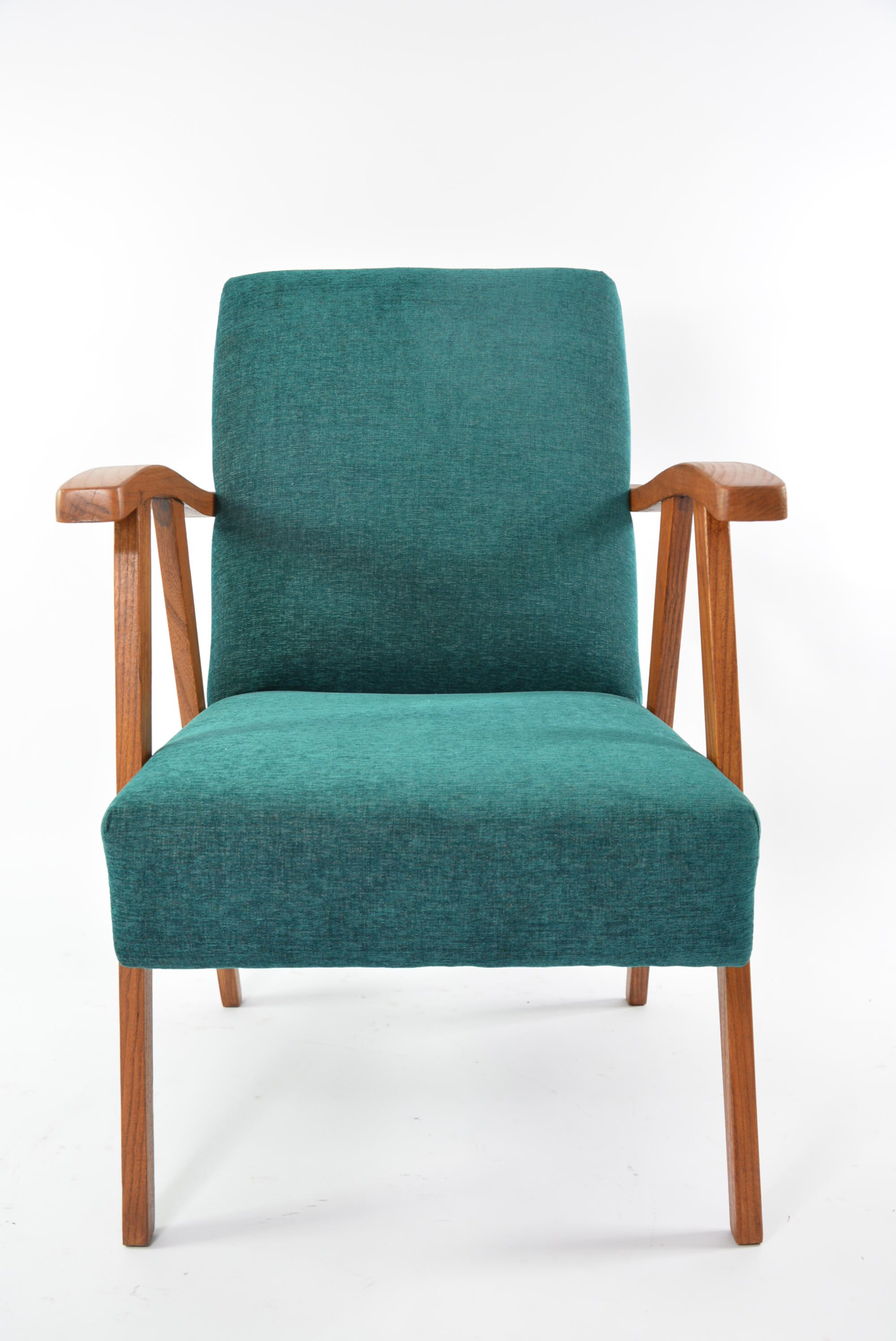 Green curved armchair