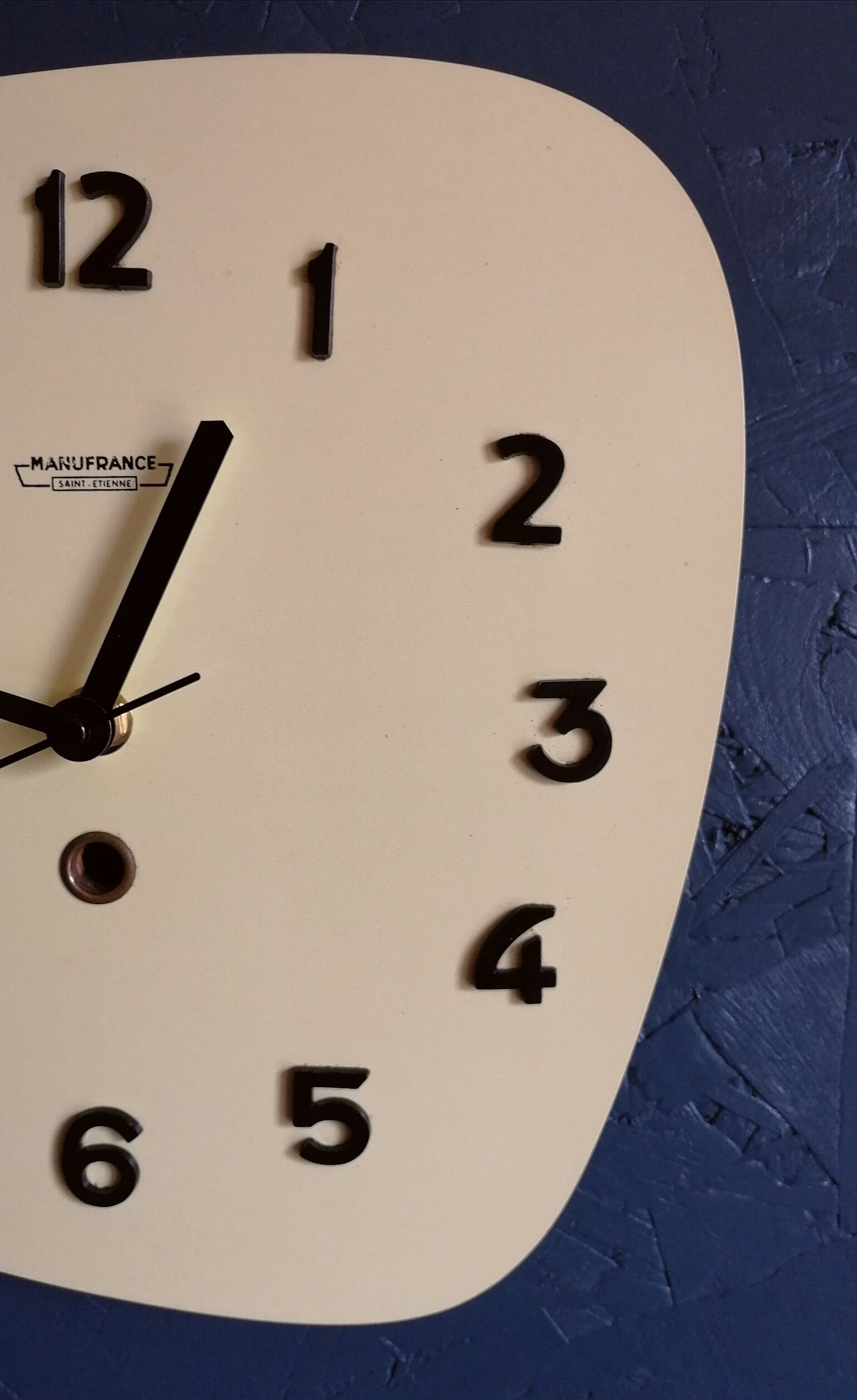 Clock formica vintage asymmetrical silent wall clock "Manufrance pale yellow"