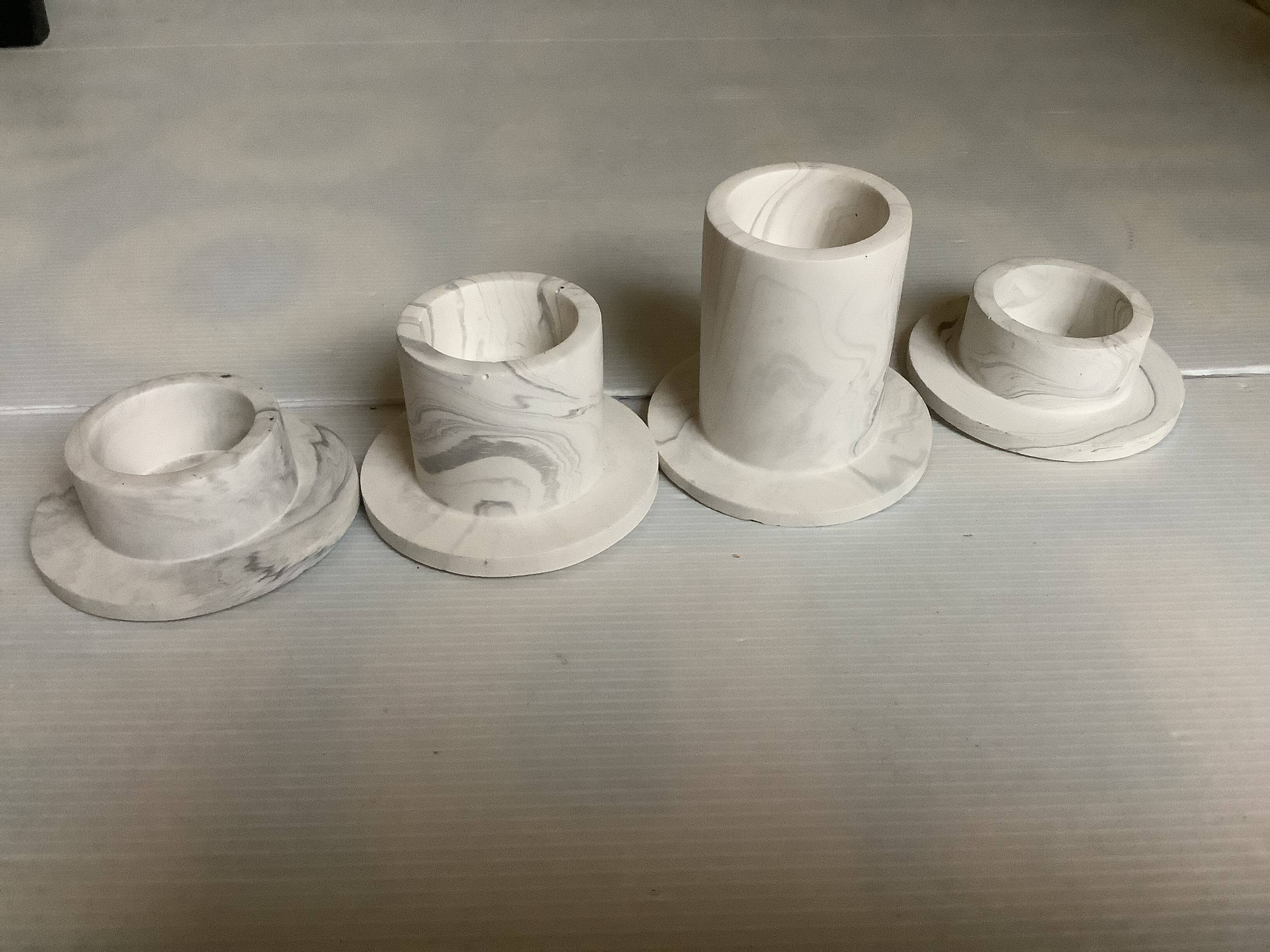 Four gypsum composite candle holders