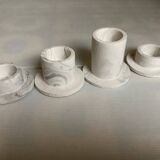 Four gypsum composite candle holders