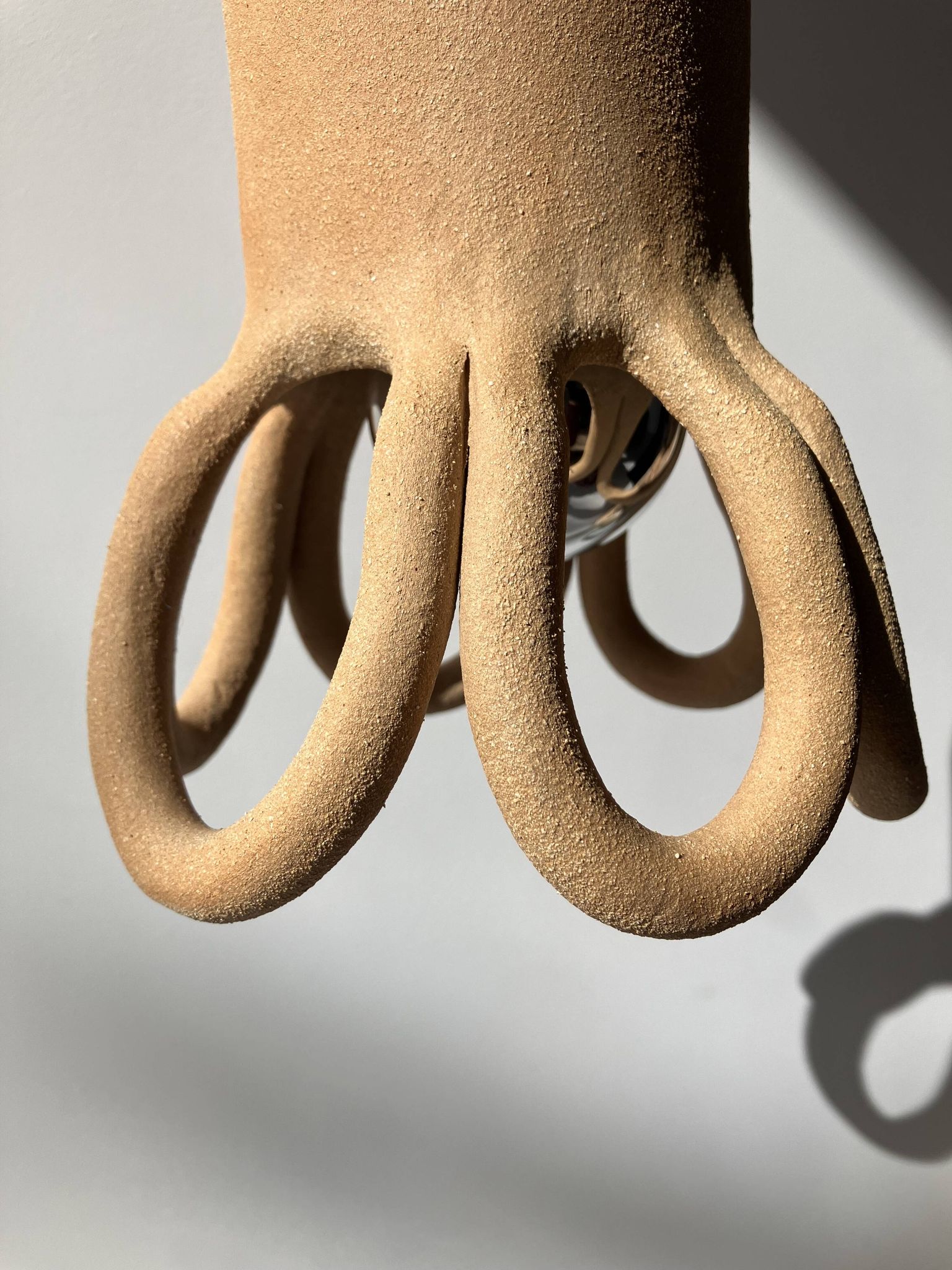 Suspension in the shape of a flower made of handcrafted ceramic, raw red stoneware mid-century.
