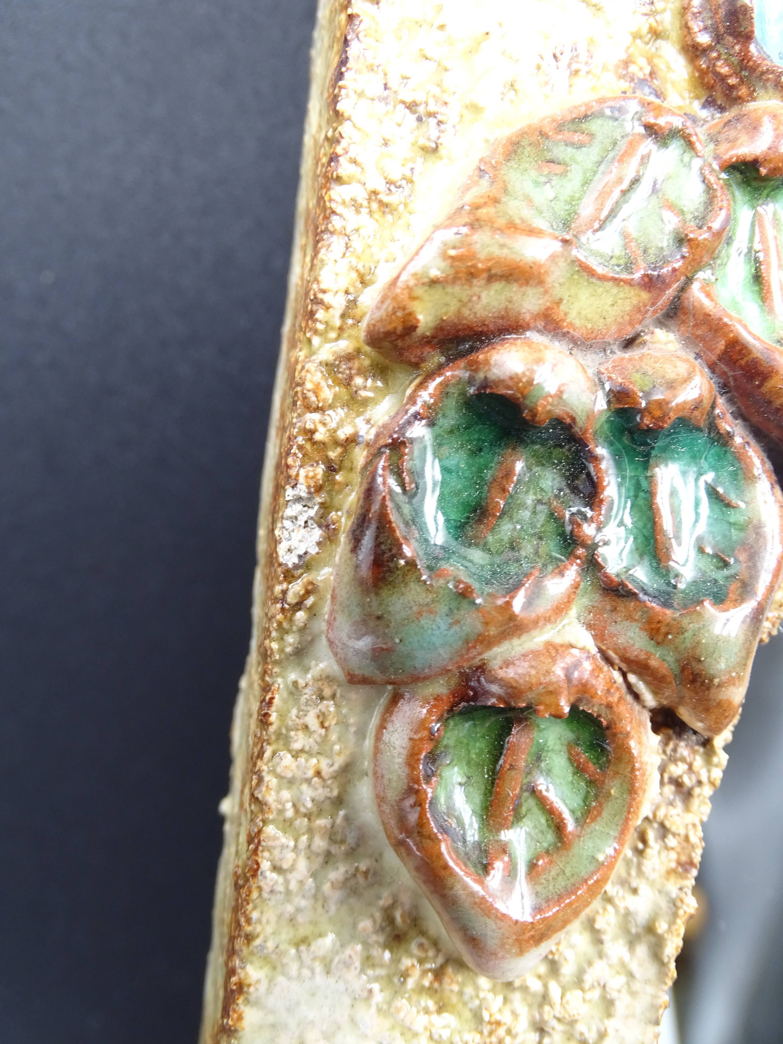 Flower-decorated sandstone mirror, circa 1970