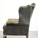 Vintage cowhide leather Chesterfield wingback armchair in a green colour