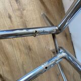 4 chrome chairs with green and white checkered tiles
