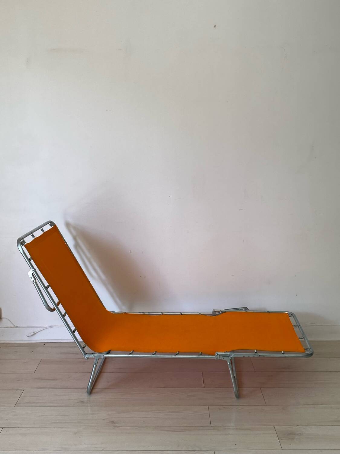 Orange and metal deckchair 1970