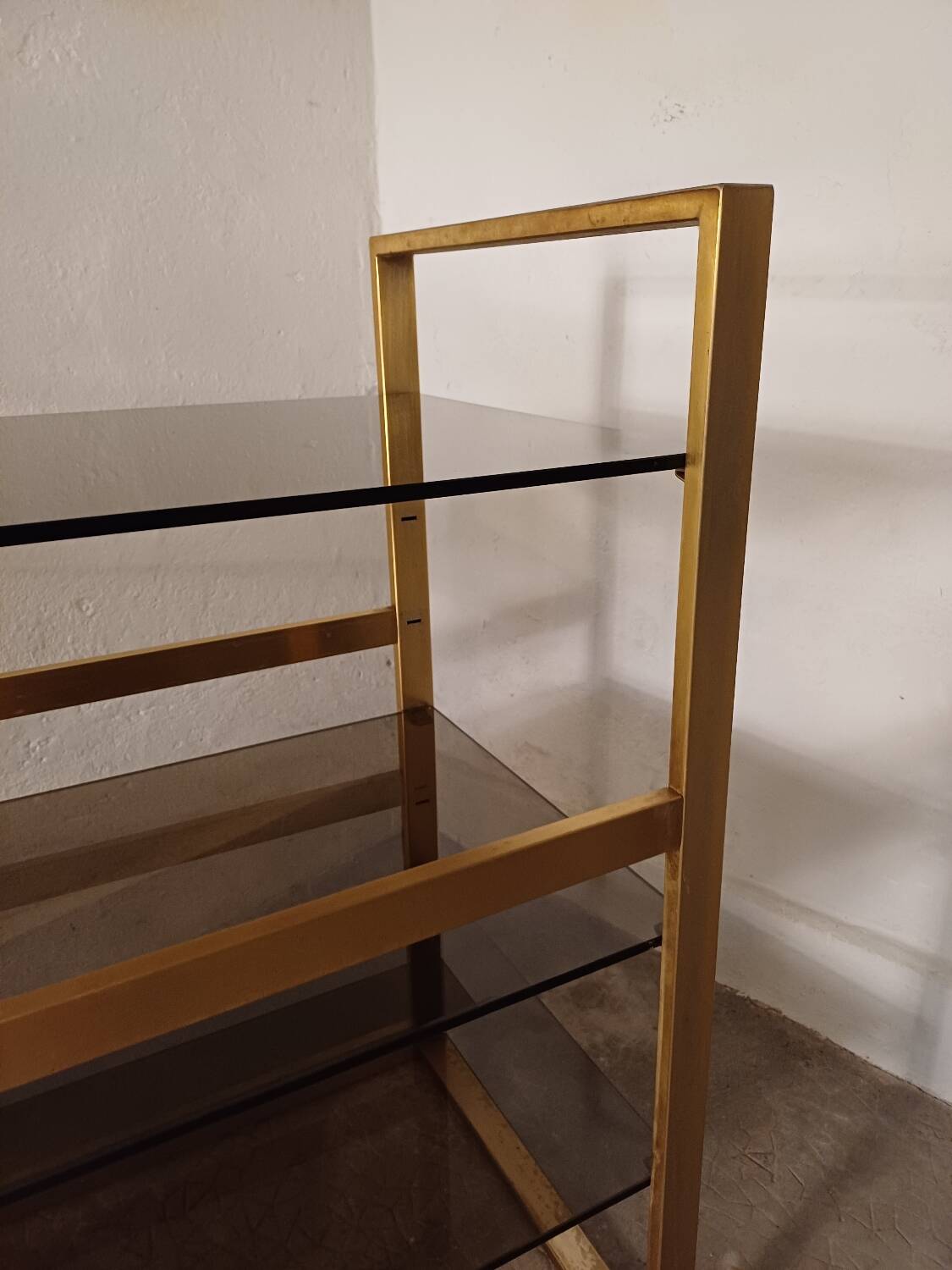 Brass shelf, smoked glass