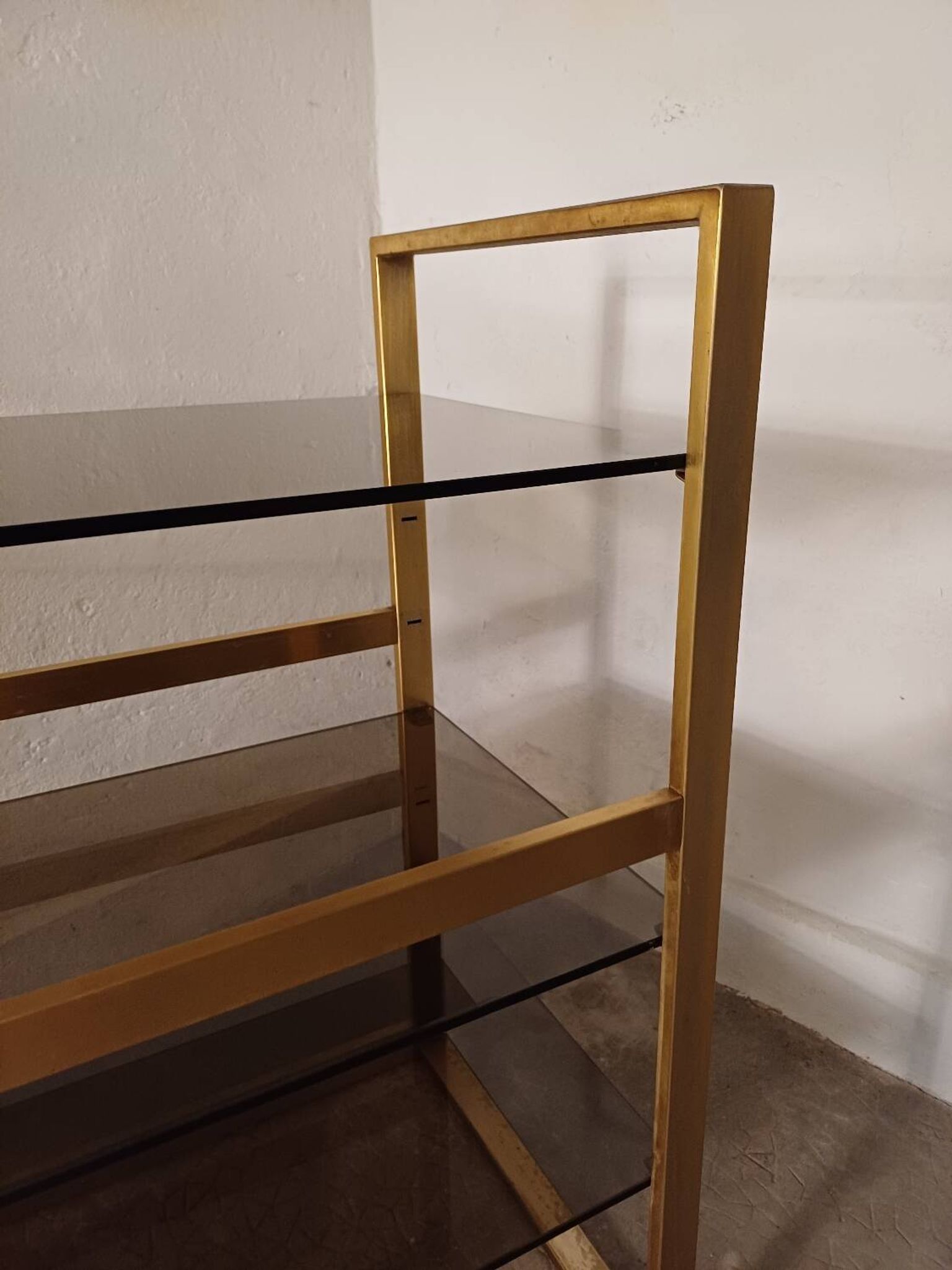 Brass shelf, smoked glass