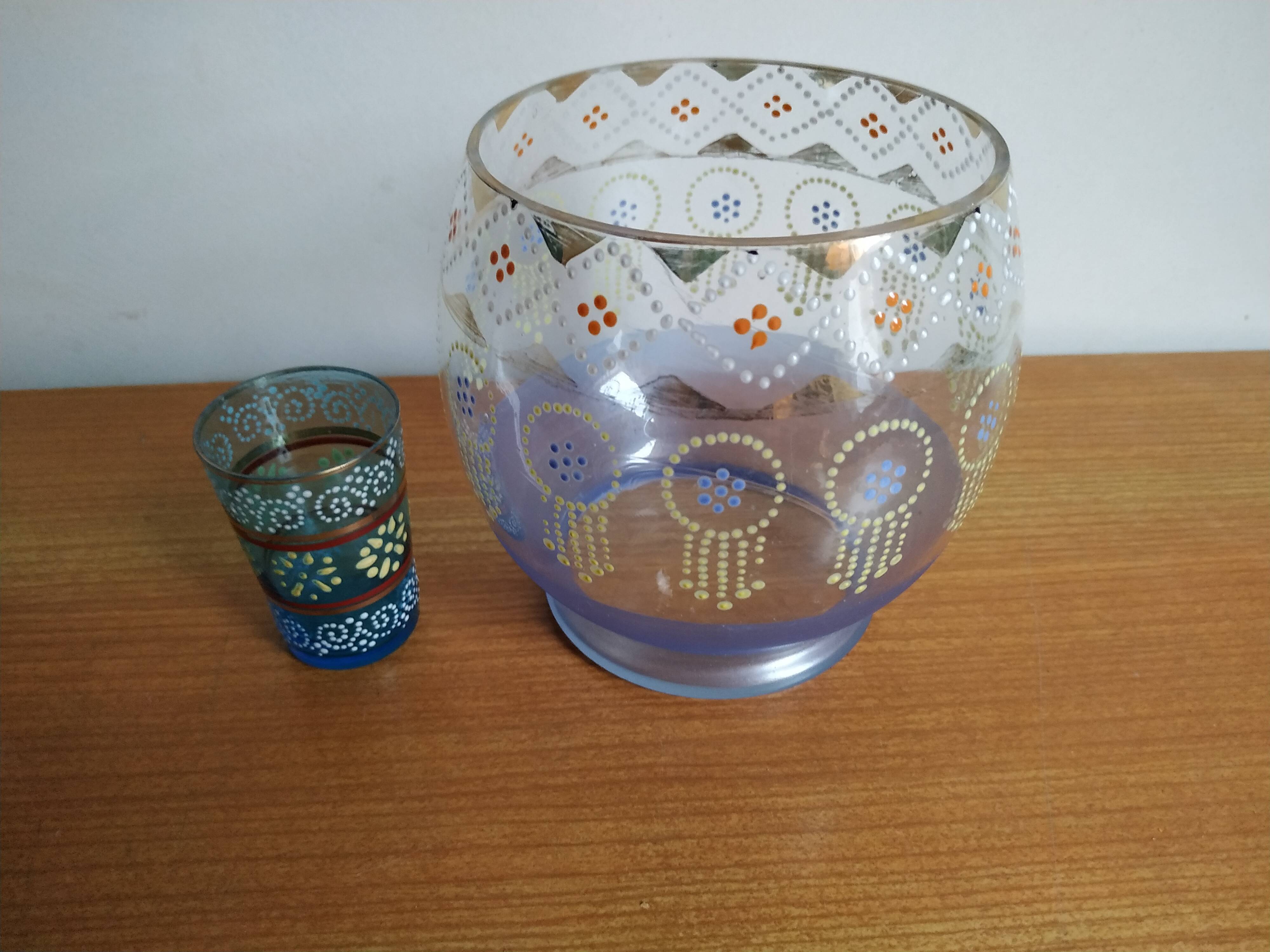 Enamelled glass ball vase decorated with beads and garlands