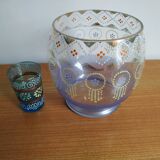 Enamelled glass ball vase decorated with beads and garlands