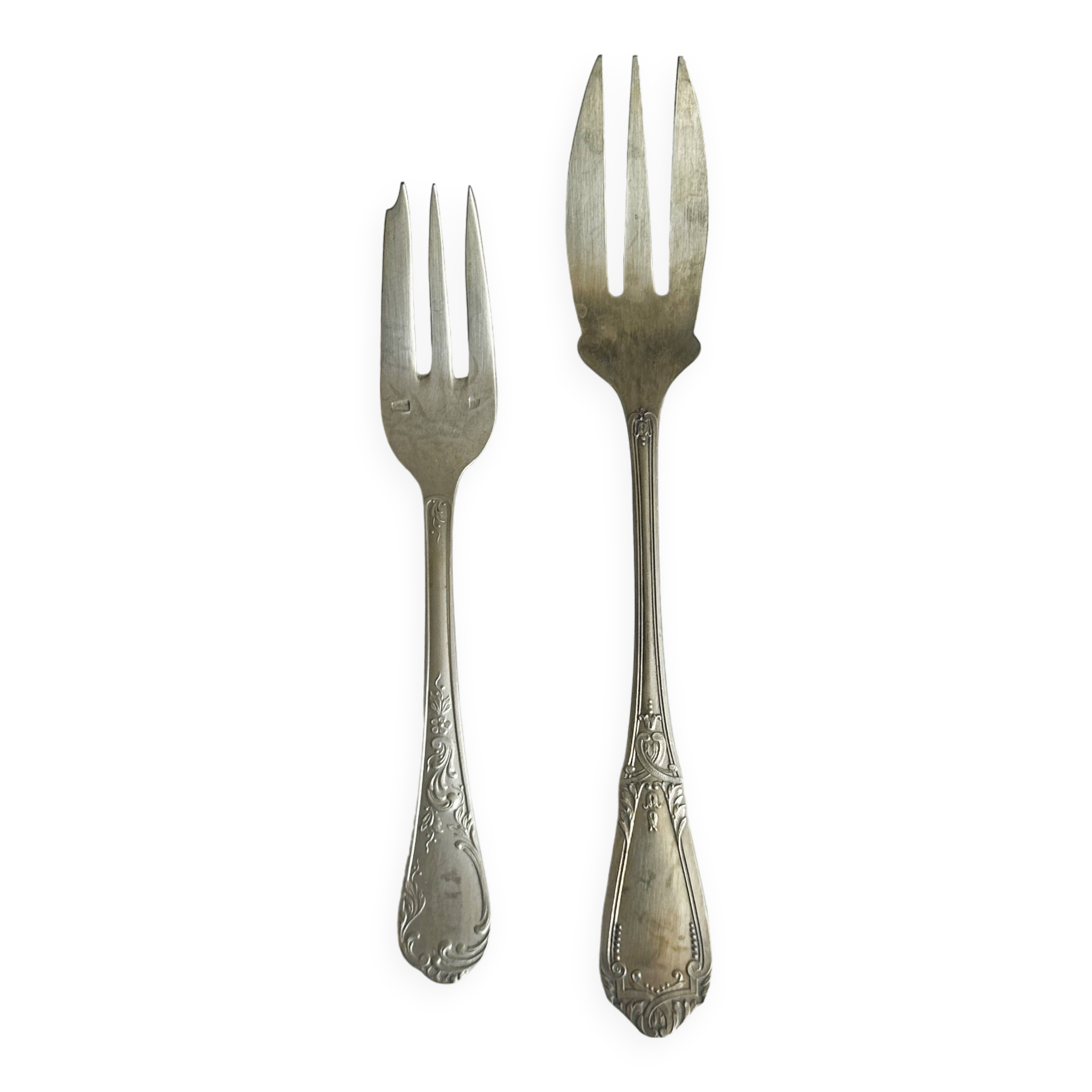 Pair of metal forks, ornate design