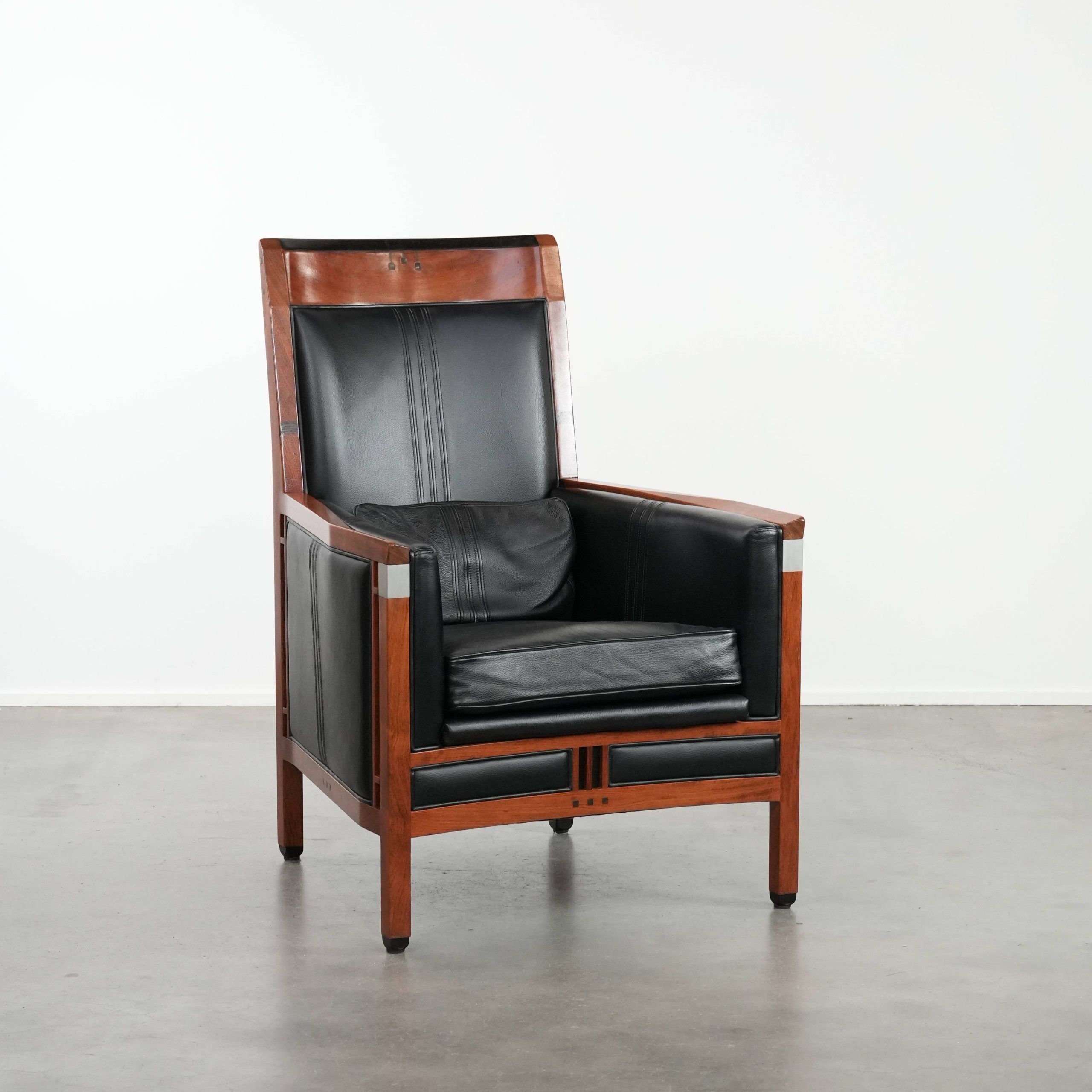 Beautiful and very comfortable black Art Deco design armchair