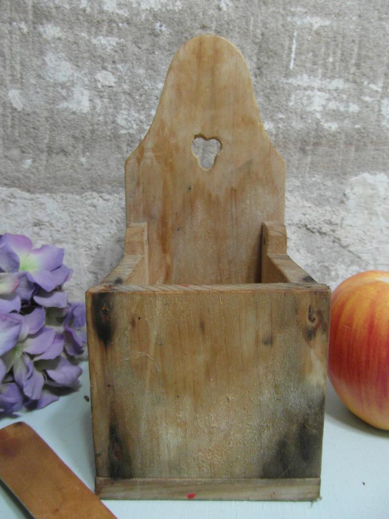Vintage wooden salt box with spoon