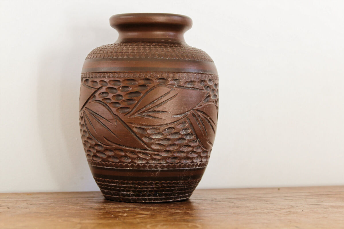 Carved terracotta vase, signed