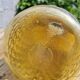 Artisanal blown amber glass vase with integrated honeycomb structure.