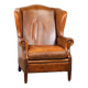 Positively lived-in sheepskin leather wing chair with pleasant seating comfort