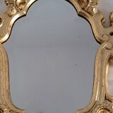 Wooden and gilded mirror with gold leaf