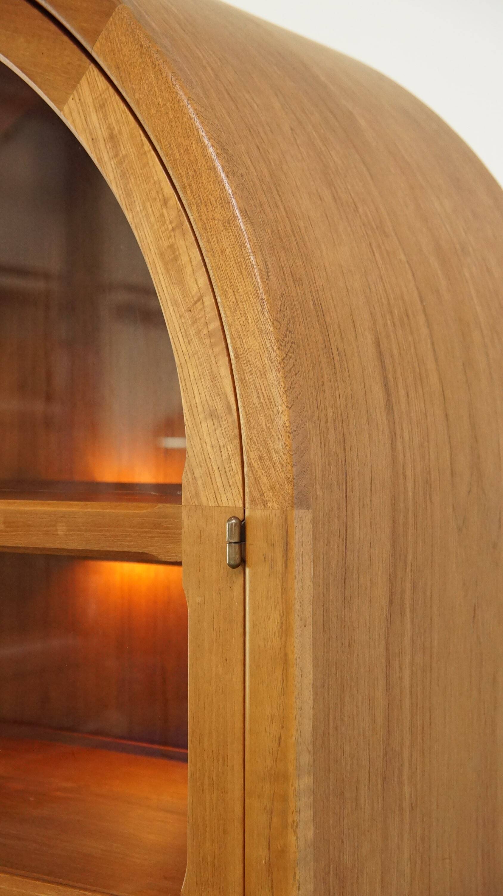 Elegant vintage Danish display cabinet with glass panels and atmospheric lighting