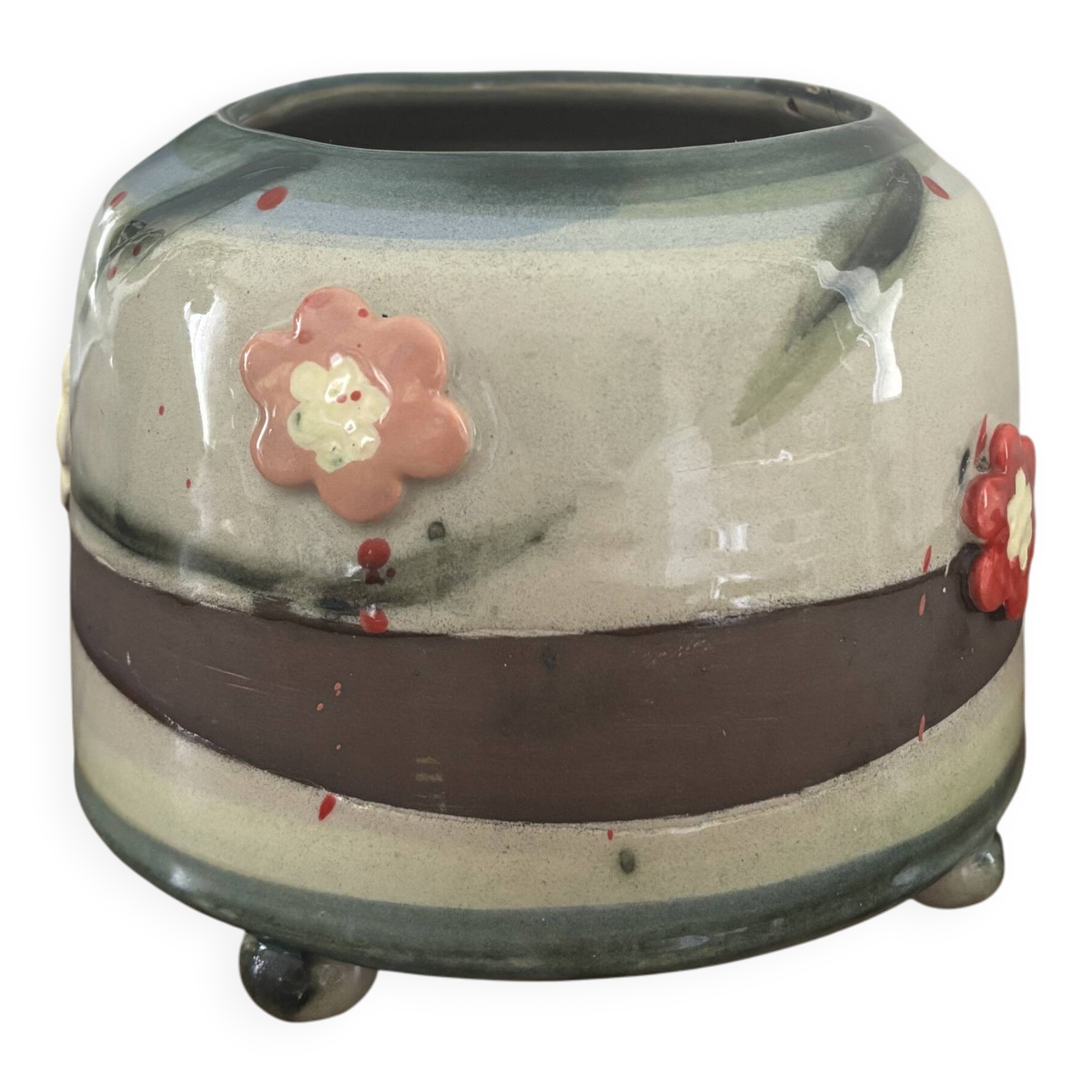 Superb handcrafted pottery pot with relief flowers signed on the back.