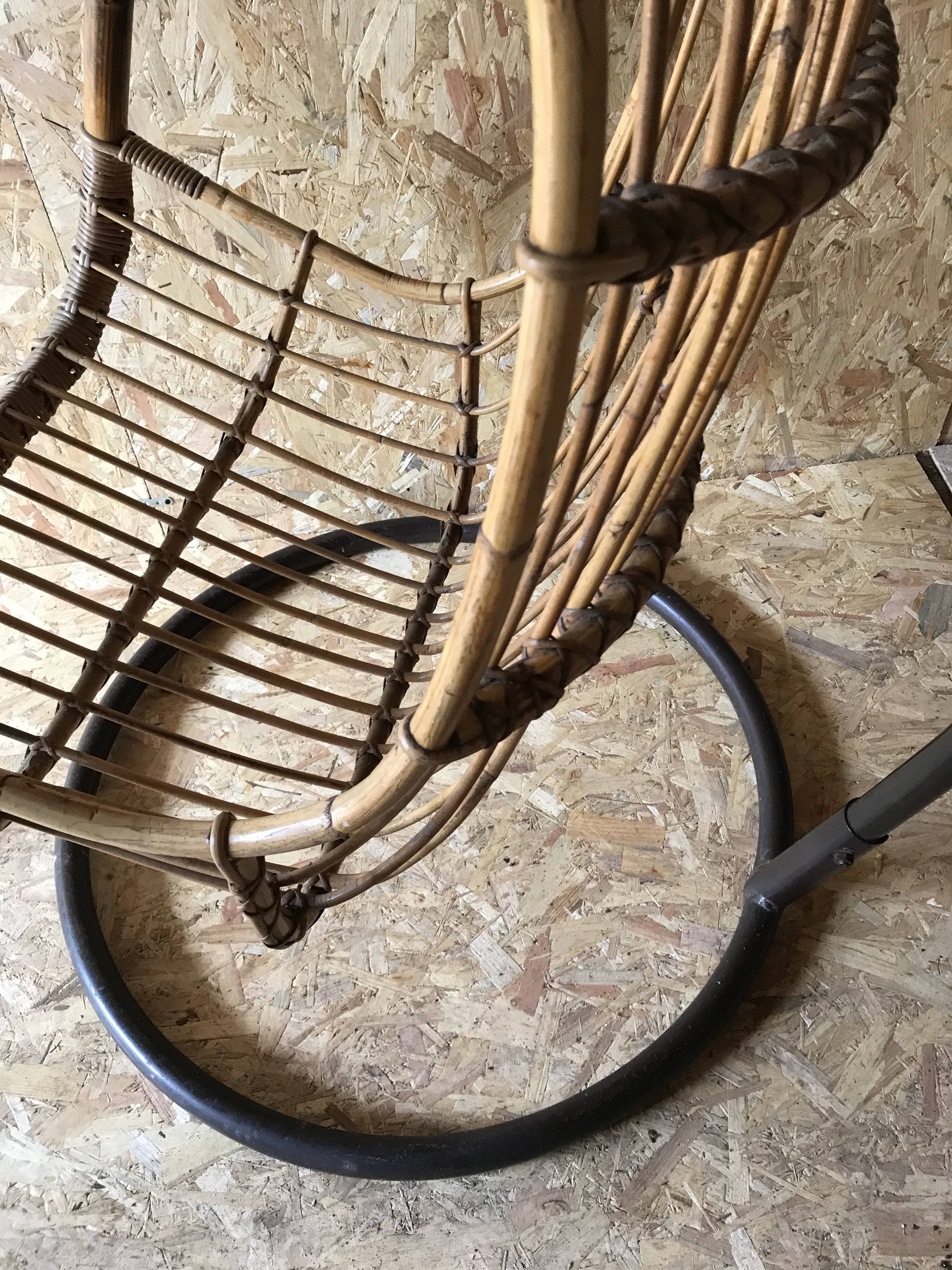 Vintage rattan hanging chair with its stand.
