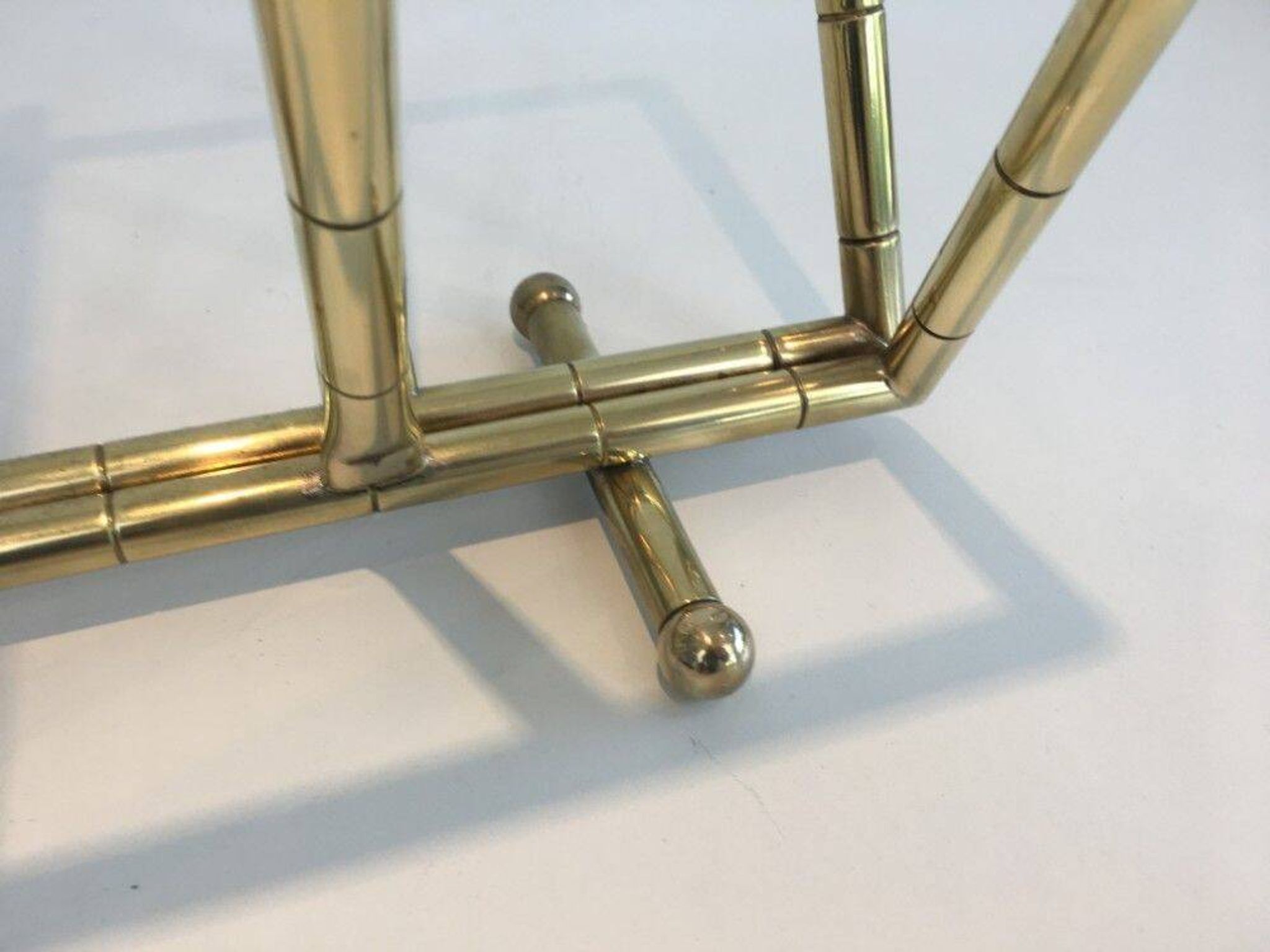Brass faux-bamboo style magazine rack