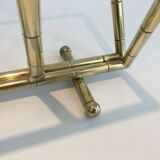 Brass faux-bamboo style magazine rack