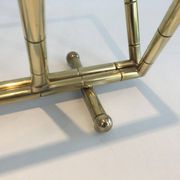 Brass faux-bamboo style magazine rack