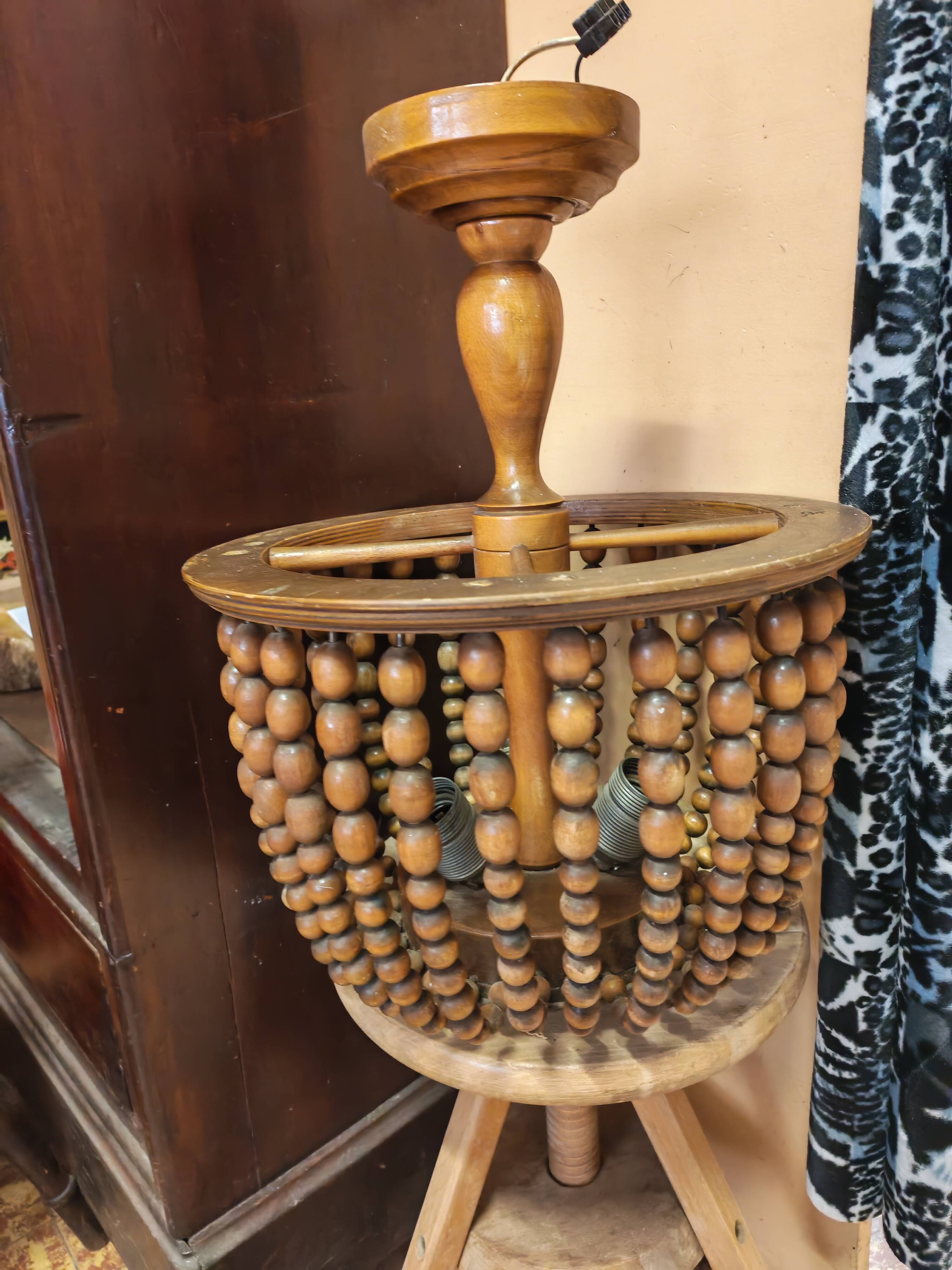 Vintage wooden turned cage chandelier with beads from the 1960s.