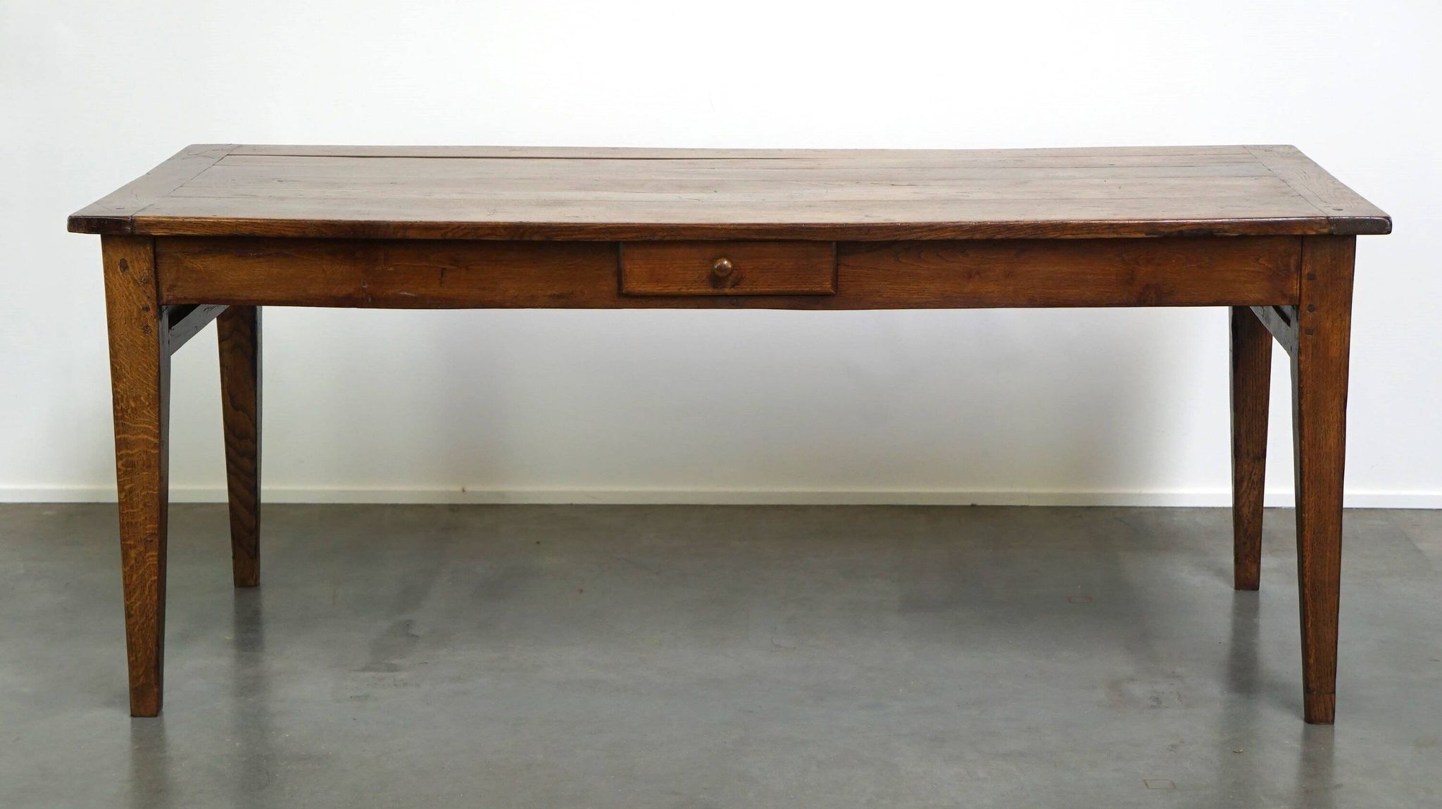 antique French oak dining table with 3 drawers and an exquisite patina