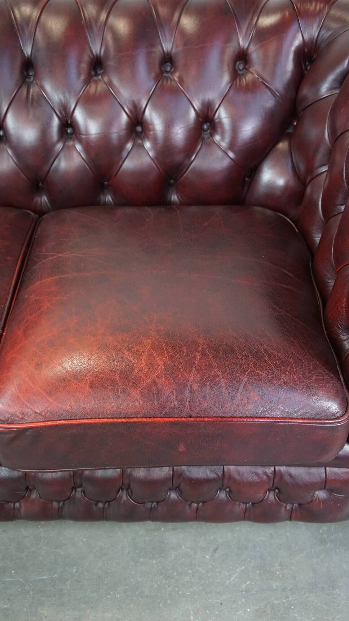 Original English Chesterfield sofa in red cowhide 2 seater