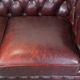 Original English Chesterfield sofa in red cowhide 2 seater