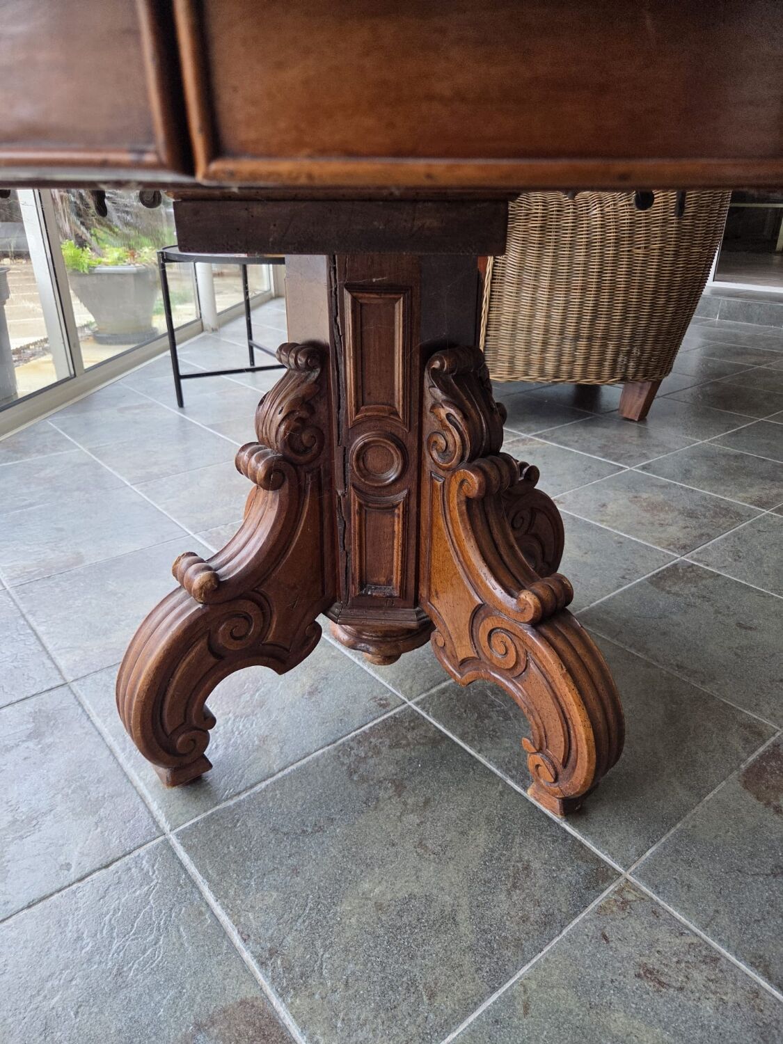 Extendable walnut table in the Napoleon III style.