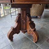 Extendable walnut table in the Napoleon III style.
