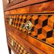 Louis XVI commode with marquetry featuring a design of precious wood cubes, 18th century.