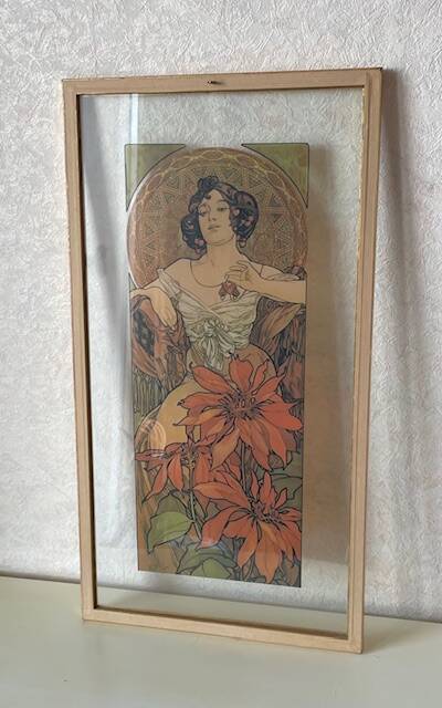 Mucha illustration on glass in a gilded frame