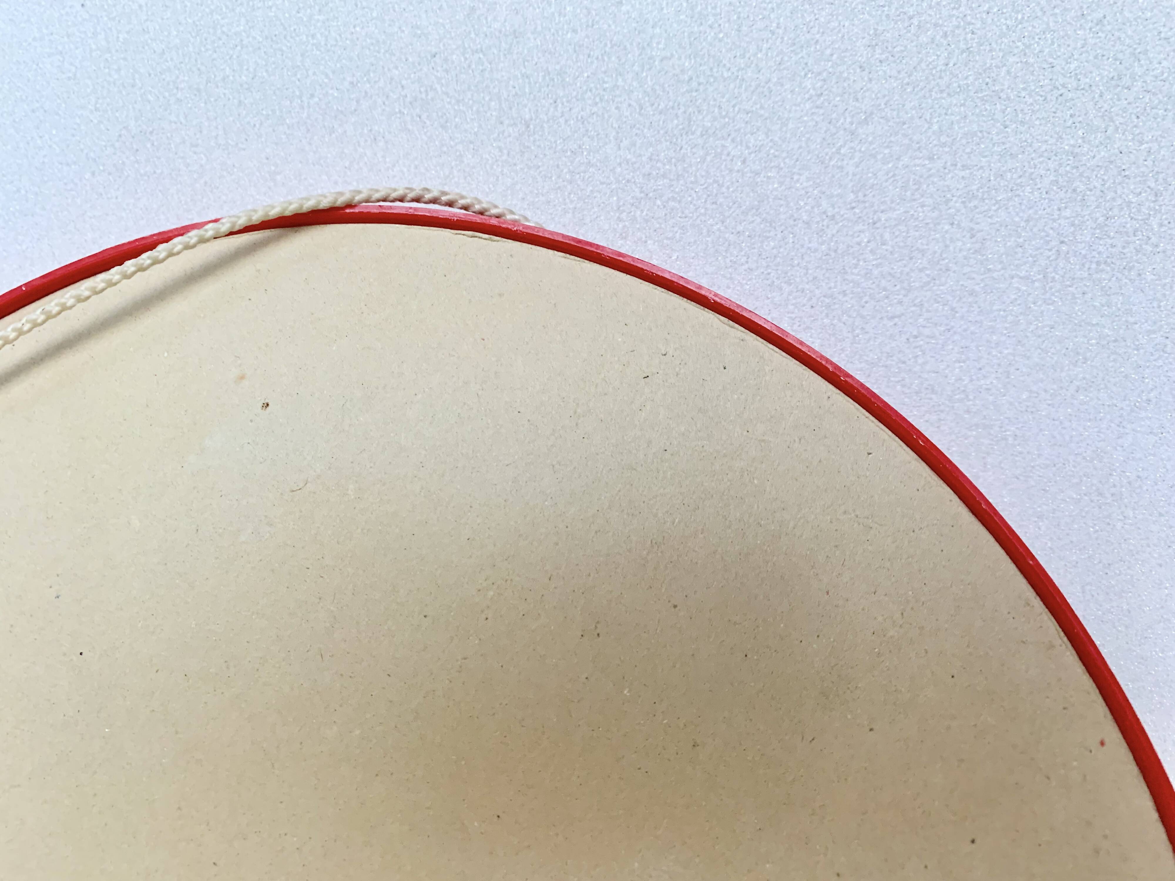 Pair of vintage round red plastic mirrors
