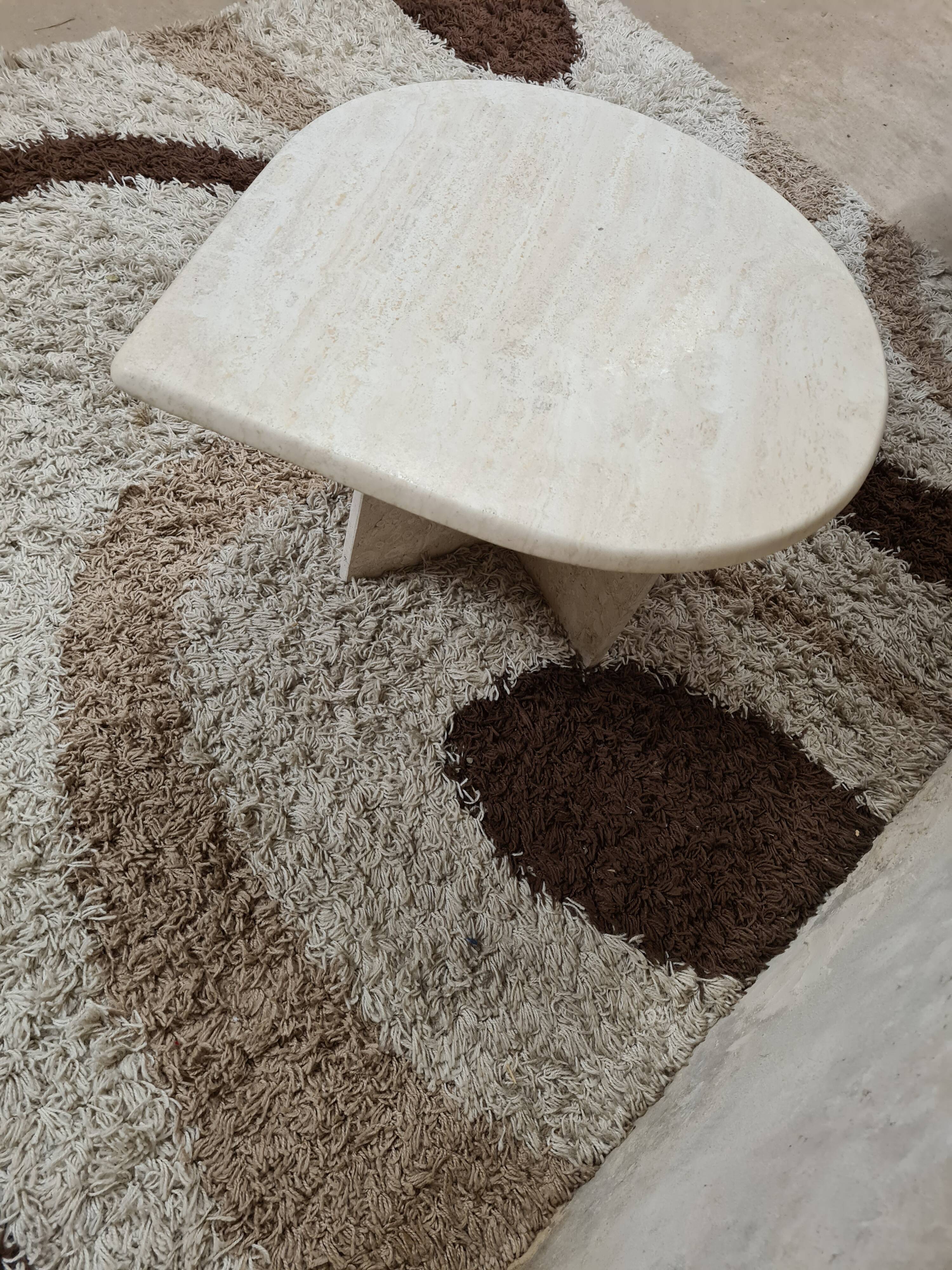 Travertine drop-shaped coffee table
