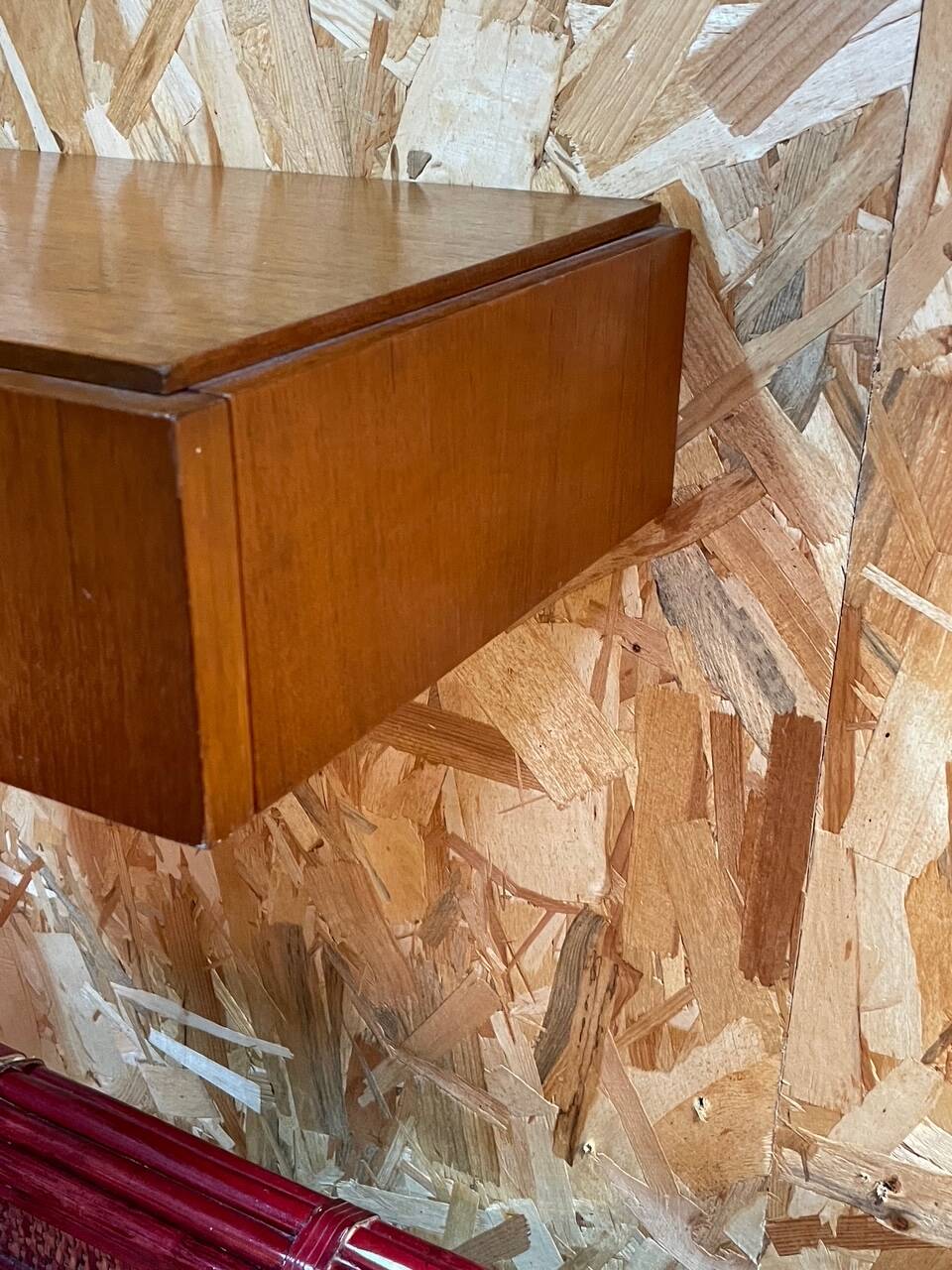 Suspended teak bedside tables in vintage 1960s Scandinavian style.