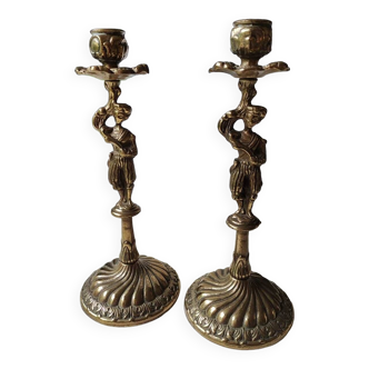 Pair of anthropomorphic candlesticks/Servants of the king holding the flame. In gilded bronze