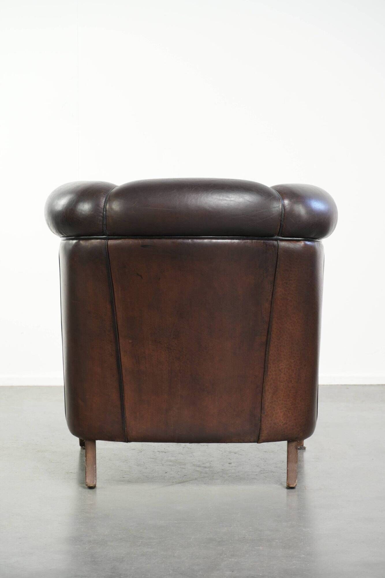 Set of a sheepskin sofa together with its matching club armchair