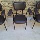 Brown faux leather armchairs