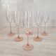 6 champagne flutes with pink stems