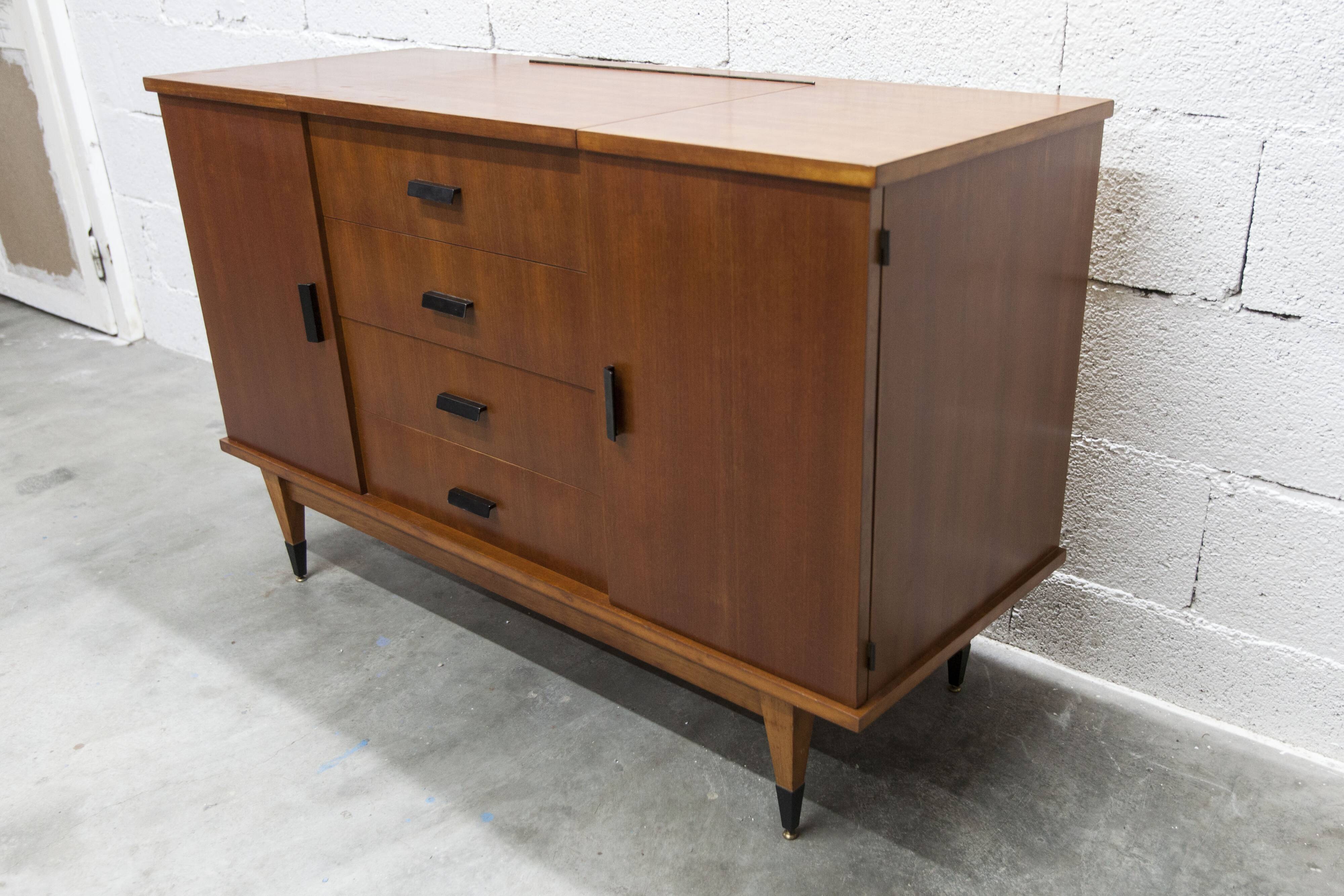 1960s teak sideboard with 4 drawers, 2 doors, and a mirror.