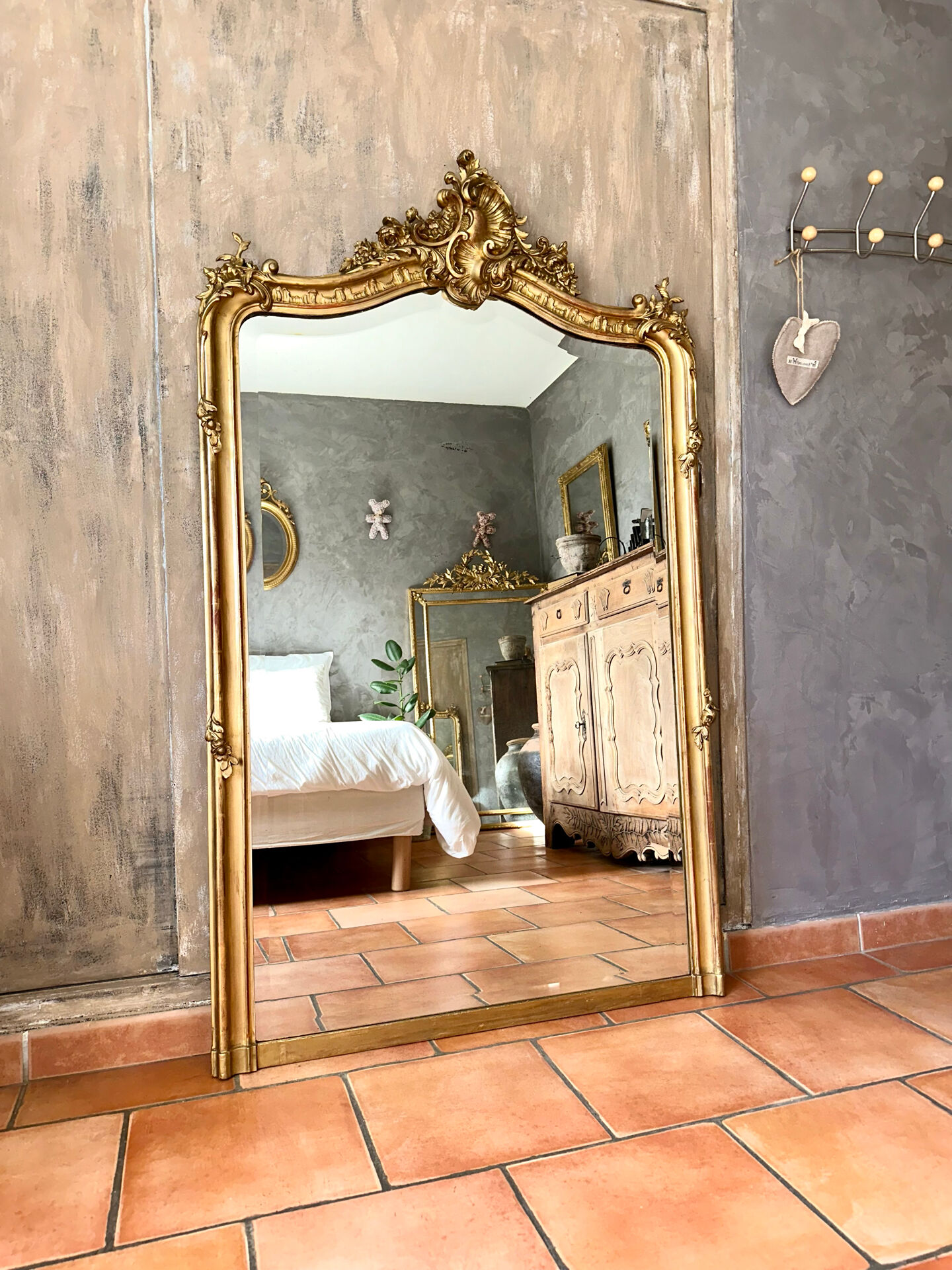 Antique gilded Louis XV pediment mirror