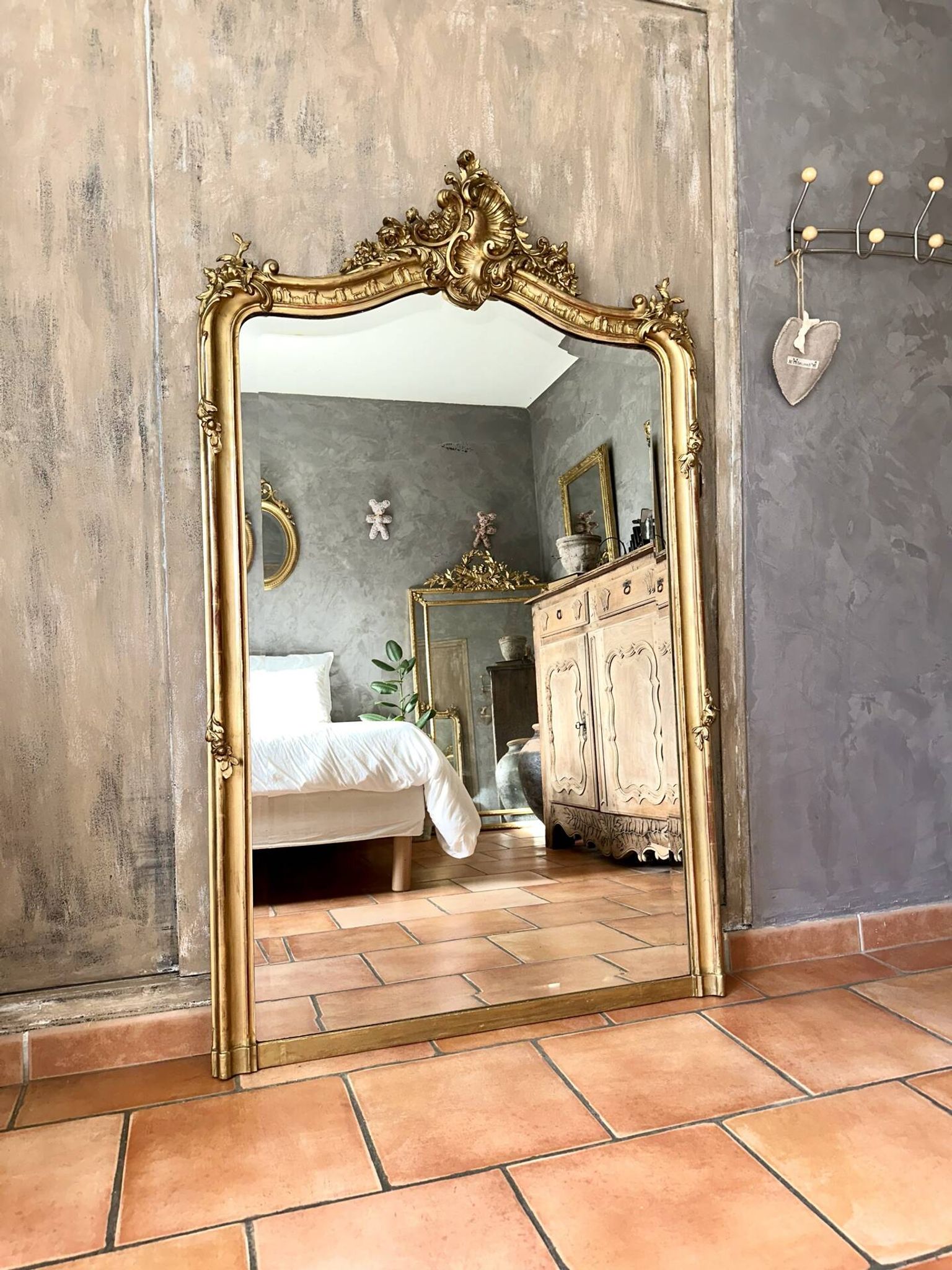 Antique gilded Louis XV pediment mirror