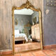Antique gilded Louis XV pediment mirror