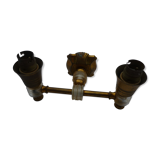 Apply two fires in gold metal and plexiglas 50