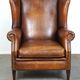 Especially comfortable wingback chair made of sheepskin leather, stunning colors