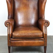 Fauteuil à oreilles particulièrement confortable en cuir de mouton, couleurs époustouflantes